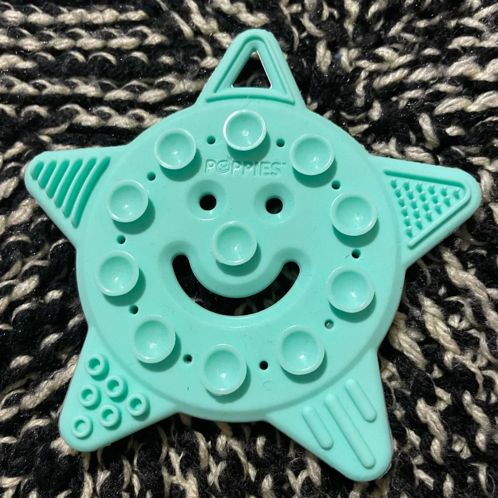 Poppies smiley the Star mint green teething toy